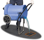 a person using the stand to tip fluid into the drain